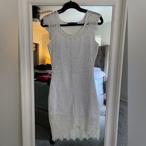 Sleeveless lace, white knee length dress